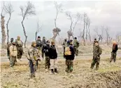  ?? AFP ?? Afghan security forces stand guard after an attack by Taliban militants near an Afghan National Army (ANA) outpost, in Kunduz Province on Wednesday. —