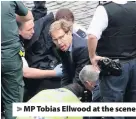  ??  ?? > MP Tobias Ellwood at the scene