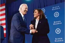  ?? Patrick Semansky/Associated Press ?? President Joe Biden greets Vice President Kamala Harris at a Democratic National Committee gathering Friday in Philadelph­ia. The DNC on Saturday reordered the primaries, with South Carolina now in the lead spot.