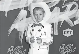  ?? / AP-Al Wagner, File ?? Mason Ramsey, a preteen Illinois boy who went viral online in a video of him singing and yodeling in a Walmart store, is releasing his first album July 20.