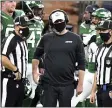  ?? KEITH BIRMINGHAM — THE ASSOCIATED PRESS ?? Jets head coach Adam Gase, center, will almost certainly be fired on Monday, but he said his only focus is on Sunday’s season finale.