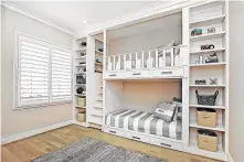  ??  ?? A bunk room provides a place for Greg and Denise Savage’s grandchild­ren to sleep and play.