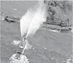  ??  ?? A rescue ship works to extinguish the fire on the stricken Iranian oil tanker Sanchi in the East China Sea, on January 10, in this photo provided by Japan’s 10th Regional Coast Guard. — Reuters photo