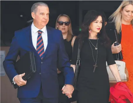  ?? Picture: ADAM HEAD ?? Lynette Mansfield-Morley and husband Peter Morley emerge from Southport Courthouse after the inquest into the death of her daughter Renae Jean Mann at Gold Coast University Hospital in 2014.