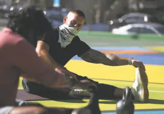  ??  ?? Israeli ( right) instructs Banothu on stretching. Banothu trains with Israeli four times a week.