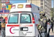  ?? AFP ?? Security personnel at the scene of a twin suicide bombing on a bustling commercial street in the heart of Baghdad.