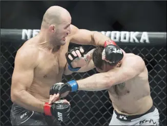  ??  ?? In this Sept. 14, 2019, file photo, Glover Teixeira, left, fights Nikita Krylov during their light heavyweigh­t match at
UFC Fight Night in Vancouver, British Columbia. (AP)