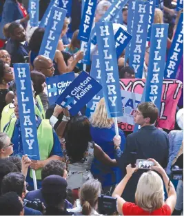  ?? STAFF PHOTO BY NANCY LANE ?? CELEBRATIO­N: Delegates to the Democratic National Convention cheer for their nominee, Hillary Clinton.