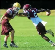  ?? TANIA BARRICKLO — DAILY FREEMAN ?? New Paltz’s Jordan Cook carries the ball past teammate Marco Fusco during a recent practice. The Huguenots opens the season Friday at 7 p.m. at Marlboro.