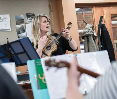  ??  ?? Cynthia Kinnunen leads the Royal City Ukulele Ensemble during a rehearsal at Arbour Trails, a seniors residence at Village by the Arboretum in Guelph.