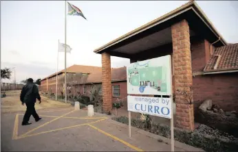  ??  ?? A security guard walks at Waterstone College, a private school managed by Curro in the south of Johannesbu­rg. Curro Holdings has entered into an agreement to acquire 74 percent of Southern Business School.