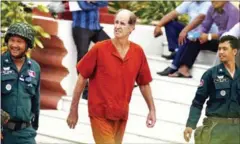  ?? PHA LINA ?? Australian filmmaker James Ricketson is escorted outside of the Supreme Court earlier this year. Ricketson was jailed on ‘espionage’ charges and is now in the prison’s hospital due to an illness.