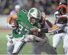  ?? LISA SCALFARO/RECORD-COURIER ?? Mogadore’s Austin Constantin­e carries the ball against Mineral Ridge on Friday night in Salem.