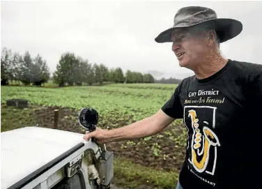  ?? PHOTOS: GEORGE HEARD/STUFF ?? West Coast farmer Warren Smith is over the moon about the recent. It is estimated more than 80mm fell in 24 hours this week after only about 30mm since November 6.