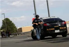  ?? (Jose Luis Gonzalez/Reuters) ?? AN OFFICER arrives at a Walmart in El Paso earlier this month after a mass shooting there.