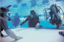 ?? KAITLYN DOLAN for The Washington Post ?? Patriot Scuba helps divers qualify for certificat­ion using adaptation­s as needed for injuries or disabiliti­es.