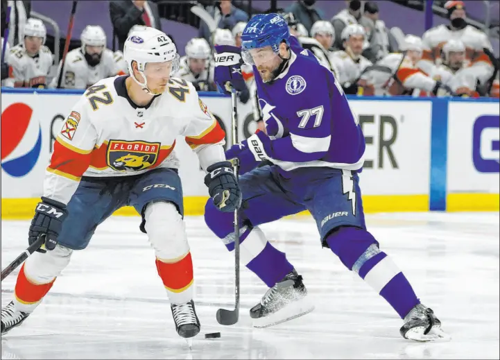  ?? Chris O’meara The Associated Press ?? Tampa Bay defenseman Victor Hedman, right, and Florida defenseman Gustav Forsling will go at it again in as their teams meet in the second round.