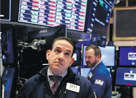  ?? RICHARD DREW/THE ASSOCIATED PRESS ?? A trader works on the floor of the New York Stock Exchange on Friday. The interestin­g thing about changing narratives is that often the underlying facts haven’t changed — the issue or concern has just been out of the spotlight, writes Tom Bradley.