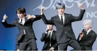  ?? Yonhap ?? Members Mark, left, and Jisung of NCT DREAM perform a portion of the new album’s lead single, “Smoothie,” during a press event at a hotel in Gwangjin District, Seoul, Monday.