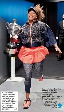  ?? — AFP ?? Japan’s Naomi Osaka celebrates with the winner’s trophy after her women’s singles final match against Jennifer Brady of the USA in the Australian Open on Saturday.