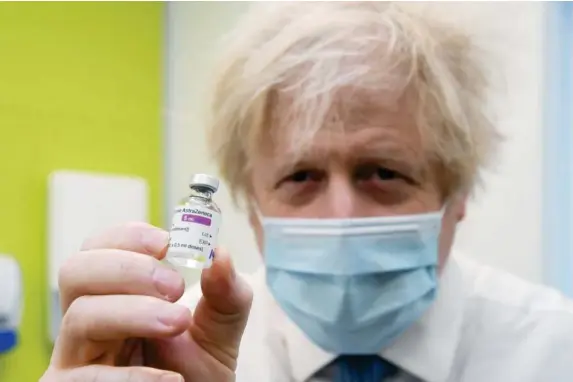  ?? (Reuters) ?? Boris Johnson has been clear that Britain will share its surplus vaccines – what he hasn’t explained is who is going to pay for them