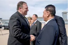  ??  ?? file photo shows Pompeo says goodbye to Kim Yong Chol (right), before boarding his plane at Sunan Internatio­nal Airport in Pyongyang. — AFP photo