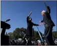  ?? EDUARDO MUNOZ ALVAREZ - THE AP ?? Democratic presidenti­al candidate Sen. Bernie Sanders, I-Vt., hugs Rep. Alexandria Ocasio-Cortez, D-N.Y. during a campaign rally on Saturday, Oct. 19, in New York.