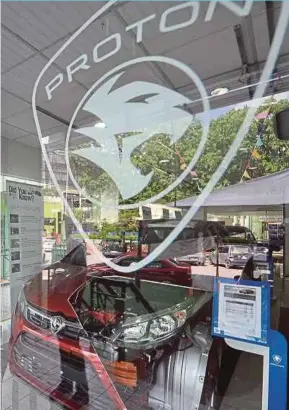  ?? ADAM ARININ
PIC BY MOHD ?? DRB-HICOM and Geely Holding are intensifyi­ng efforts to finalise the detailed business plan for Proton Holdings Bhd.