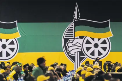  ??  ?? Delegates wait for a speech by Jacob Zuma (above), then SA president, during the 54th national conference of the ANC in Johannesbu­rg in 2017. A Soweto voter (below) casts a ballot in the 2019 general election. Photos: Waldo Swiegers/Bloomberg via Getty Images