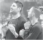  ?? STEPHEN M. DOWELL /ORLANDO SENTINEL ?? Magic center Nikola Vucevic, left, and guard Evan Fournier joke around before a 2014 game. Vucevic has poked fun at some of Fournier’s previous haircuts, which have evolved during the French guard’s tenure in Orlando.