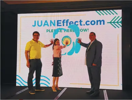  ?? SUNSTAR FOTO / MICHELLE SO ?? JUAN EFFECT. (From left) Cebu Pacific president and CEO Lance Gokongwei, Tourism Secretary Bernadette Romulo-Puyat and Environmen­t Undersecre­tary Sherwin Rigor present Cebu Pacific’s sustainabl­e tourism program called Juan Effect at the Makati...