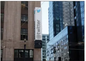  ?? (AP/Jed Jacobsohn) ?? A sign is seen outside the Twitter headquarte­rs in San Francisco, on April 25. Elon Musk reached an agreement to buy Twitter for roughly $44 billion, promising a more lenient touch to policing content on the platform where he promotes his interests, attacks critics and opines on social and economic issues to more than 90 million followers.