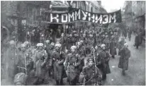  ??  ?? Above: Communist troops carry a banner that translates as “communism” during the Russian Revolution in October 1917. Left: A map shows the Ukrainian Soviet Socialist Republic and the Volhynia region, which at the time of the Kautz family’s departure for Canada was home to a minority population of German-speaking Ukrainians.