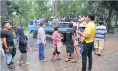  ??  ?? BELOW Visitors getting on the shuttle truck in Pa Hin Ngam National Park.