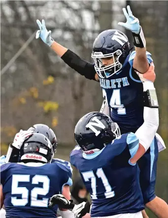  ?? QUINN HARRIS/SUN-TIMES ?? Nazareth’s Alexander Angulo (24) celebrates after one of his two touchdowns Saturday.