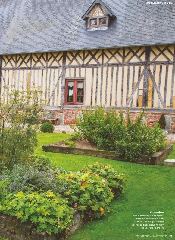  ??  ?? Exterior The Normandy wood-frame barn dates from the 17th century. The couple added six raised beds using railway sleepers for borders