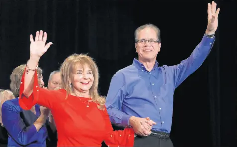  ?? JIM YOUNG/GETTY PHOTOS ?? Republican Senate candidate Mike Braun and his wife, Maureen, arrive at an election night rally Tuesday in Indianapol­is. Braun defeated incumbent Democratic Sen. Joe Donnelly.