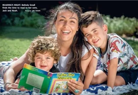  ?? Picture: JAY TOWN ?? READING’S RIGHT: Belinda Small finds the time to read to her sons, Jack and Noah.