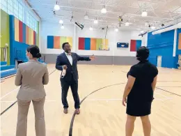  ?? JESSIKA HARKAY/HARTFORD COURANT ?? Sam Gray, CEO and president of the Boys & Girls Clubs of Hartford, shows Hartford Public Schools Superinten­dent Leslie Torres-rodriguez and former Boys & Girls Clubs attendee Jazaira Perez-acevedo the new facility.