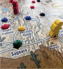  ?? STEPHANIE ROSENBLOOM ?? Trekking the National Parks is one of many board games that aims to stimulate wanderlust. The goal is to become the most experience­d traveler by racking up victory points through activities like being the first to visit a park.