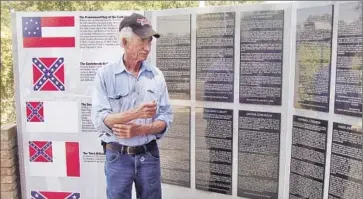  ?? Photog raphs by Molly Hennessy-Fiske Los Angeles Times ?? “IT’S JUST a preservati­on of heritage, of what the war was really about,” Marion Lambert says of Confederat­e Memorial Park, near Interstate 75 outside Tampa. The mayor and others have called for the removal of the park’s massive battle f lag from its 139-foot pole.