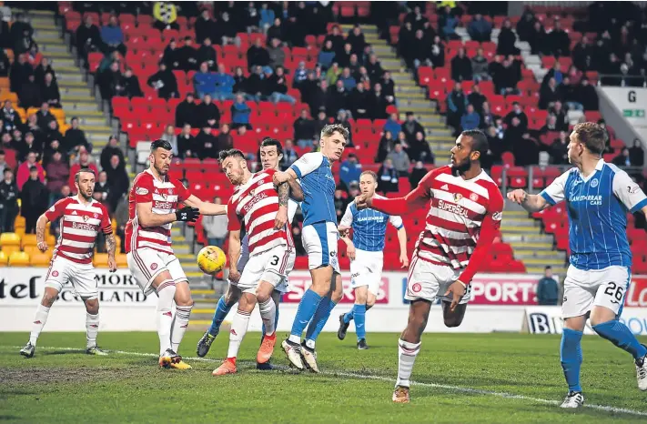  ?? Picture: SNS. ?? The ball cannons off Hamilton defender Scott Mcmann (3) for an own goal to give St Johnstone the lead.
