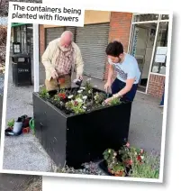  ??  ?? The containers being planted with flowers