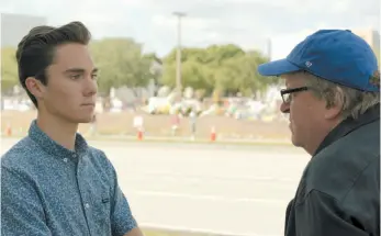  ?? PHOTO BY BRIARCLIFF ENTERTAINM­ENT-GATHRFILMS ?? Filmmaker Michael Moore, right, interviews David Hogg, a survivor of the Parkland school shooting and a gun-control activist.