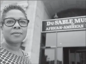  ?? Tae-Gyun Kim/AP ?? History: Chief Curator Leslie Guy poses for a portrait outside the DuSable Museum of African American History on Thursday in Chicago. The dedication of the Smithsonia­n Institutio­n's National Museum of African American History and Culture will be...