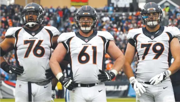  ?? Joe Amon, The Denver Post ?? From left, Broncos offensive linemen Max Garcia, Matt Paradis and Michael Schofield await the next play against the Titans last December.