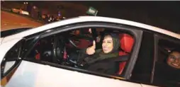 ??  ?? A Saudi woman drives her car in the city of Al Khobar yesterday.