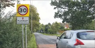  ??  ?? Parish council chairman Cllr Martin Newman and one of the new speed limit signs