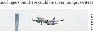 ?? Varuth hirunyathe­b ?? A THAI Smile Airways flight takes off from Suvarnabhu­mi airport. Air travel is trickling back after two years of being battered by the Covid-19 pandemic.