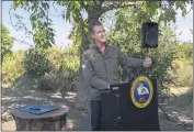  ?? RENÉE C. BYER — THE SACRAMENTO BEE ?? Gov. Gavin Newsom speaks during a news conference at Sierra Orchardswa­lnut farminWint­ers in Solano County on Wednesday.